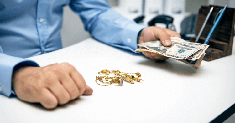 Pawn broker giving cash for jewelry